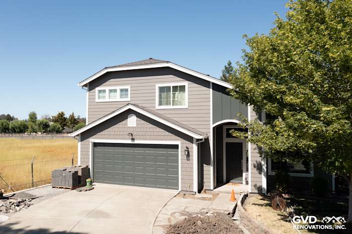 Exterior of a renovated home featuring James Hardie Aged Pewter siding and Arctic White trim in Rohnert Park