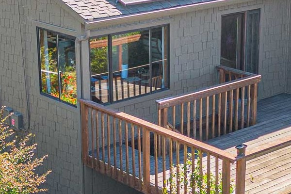 Home exterior in Vallejo featuring James Hardie Shake siding, custom paint, and solar panels on the roof