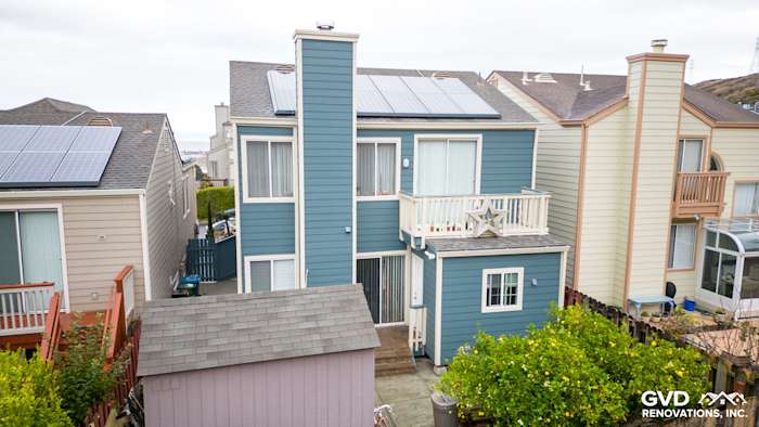 Daly City home showcasing Evening Blue HardiePlank lap siding and solar panels on the roof