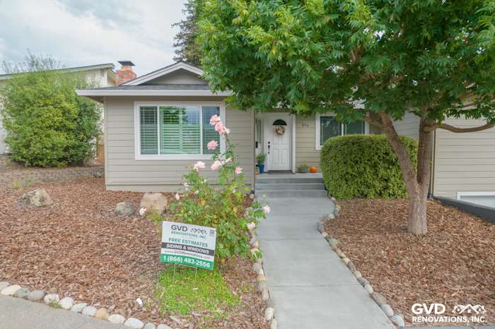 Monterey Taupe James Hardie siding with Arctic White trim, Anlin windows, and landscaped entryway in Petaluma