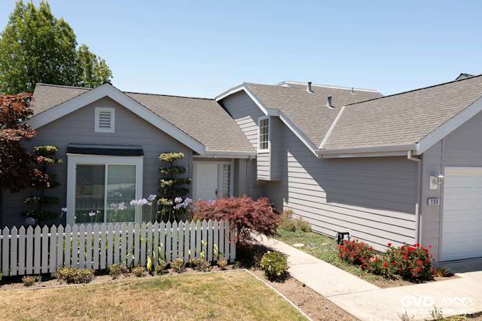 Foster City home exterior featuring James HardiePlank Lap Siding in Pearl Gray and Arctic White HardieTrim Boards