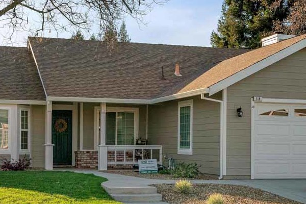 Exterior view of a home showcasing Monterey Taupe HardiePlank siding and Arctic White trim in Folsom, CA