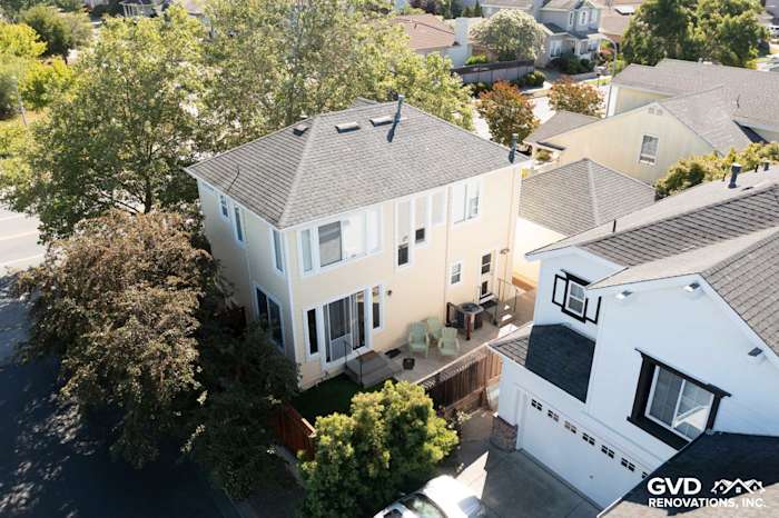 Two-story home in Petaluma with new Prodigy Insulated Vinyl Siding and lush landscaping, showcasing energy-efficient design