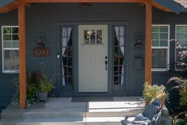 Home exterior showcasing James Hardie Iron Gray siding and contrasting trim, landscaped garden in Sacramento