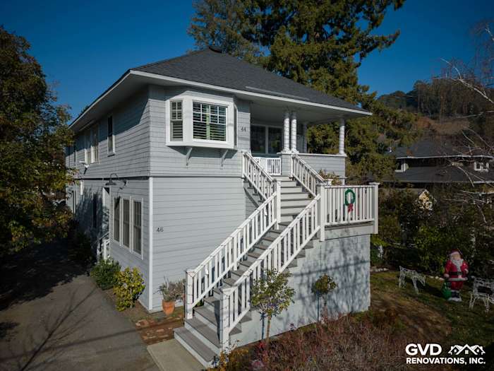 Two-story home in San Anselmo featuring Prime James Hardie Lap Siding in light blue, with white trim and railings