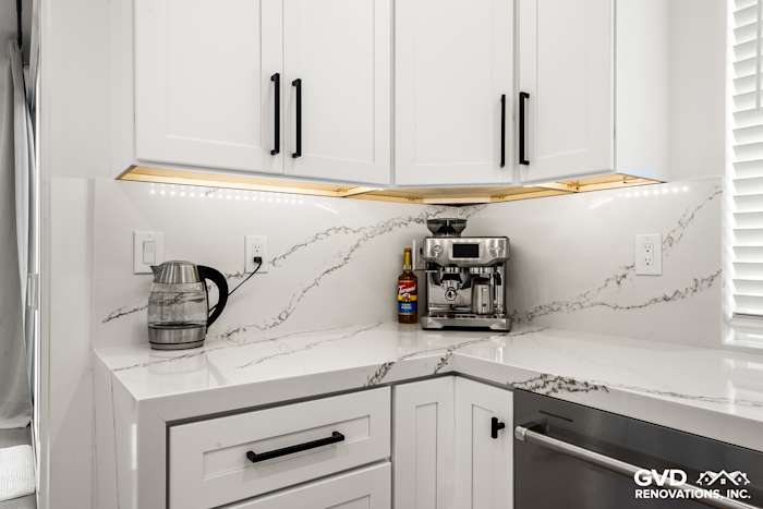Custom kitchen corner featuring quartz countertops, white cabinets, and a coffee station in Antelope, CA