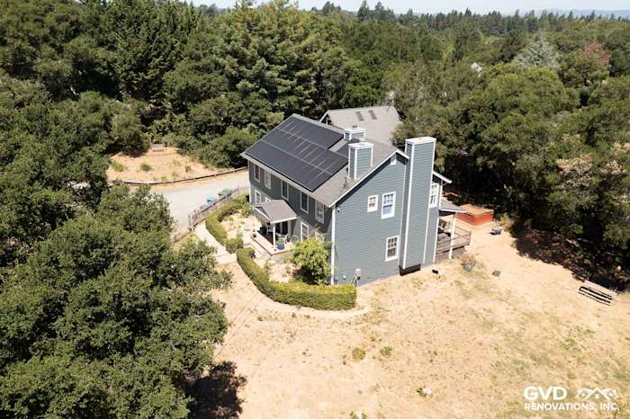 Newly installed Evening Blue James Hardie siding on a two-story home with Arctic White trim in Sebastopol