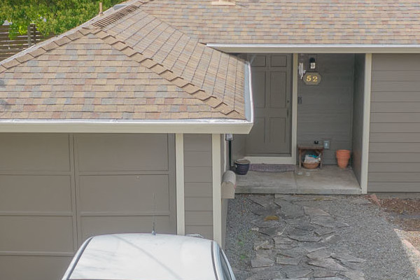 Home exterior featuring Prodigy Solid Core Siding in light gray, driveway, and nearby landscaping in Mill Valley, CA