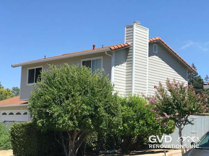 Arctic White HardiePlank siding on a two-story home with lush landscaping in Concord, CA