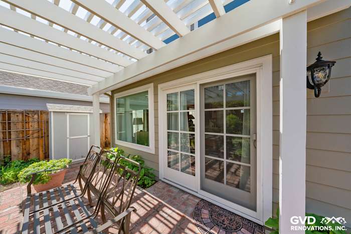 Monterey Taupe James Hardie lap siding with Arctic White trim and Alside Mezzo windows in Foster City patio area