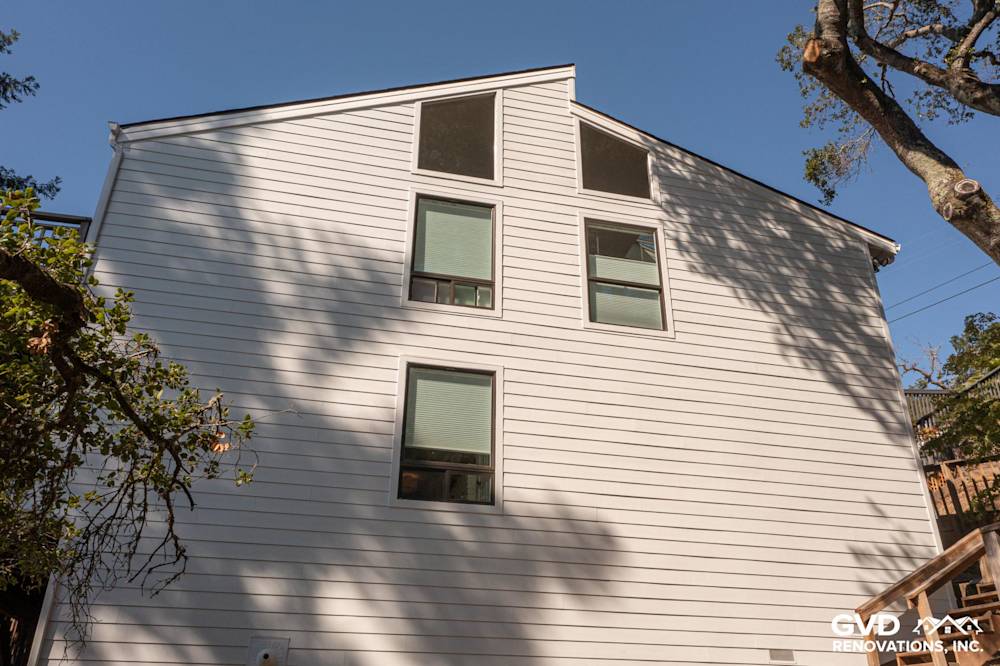 New Arctic White James Hardie lap siding installed on a home exterior in Novato, CA