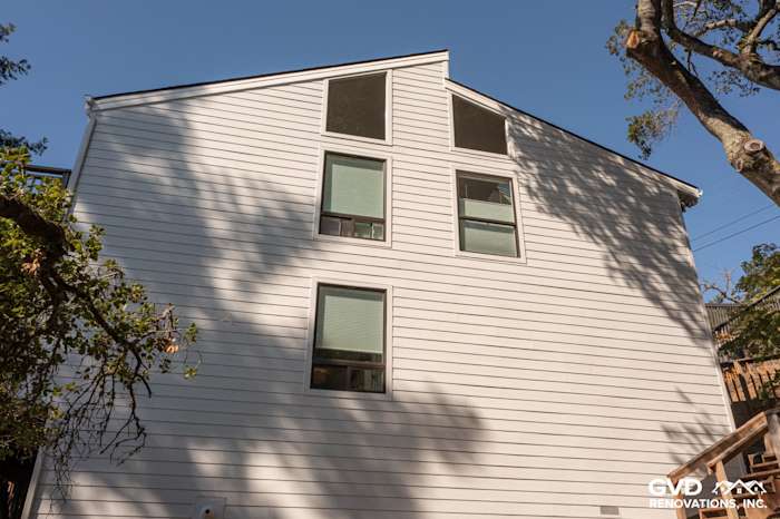 New Arctic White James Hardie lap siding installed on a home exterior in Novato, CA