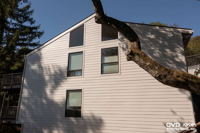 New Arctic White James Hardie lap and vertical siding installed on a home exterior in Novato, CA