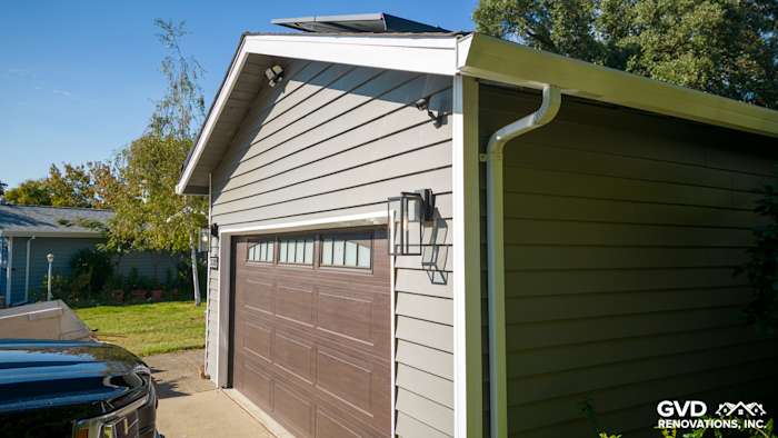 New Alside Prodigy vinyl siding in soft gray on a renovated garage exterior in Carmichael, CA