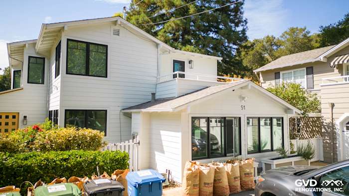 New Arctic White James Hardie siding installed on a modern home exterior in Orinda, CA, with landscaping visible