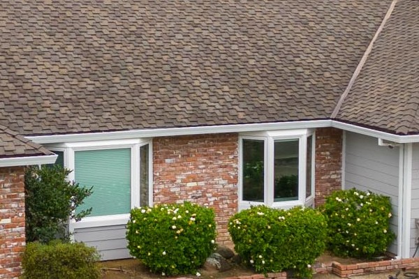 Roseville home exterior featuring James Hardie Cedarmill siding, Milgard windows, and lush landscaping