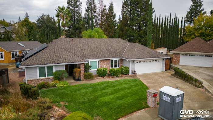 Roseville home exterior featuring James Hardie Cedarmill siding, Milgard windows, and lush landscaping