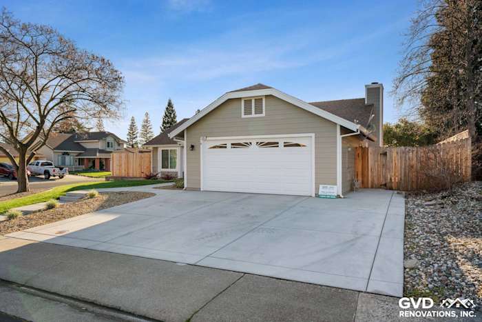 Home exterior featuring Monterey Taupe HardiePlank siding and Arctic White trim in Folsom, CA