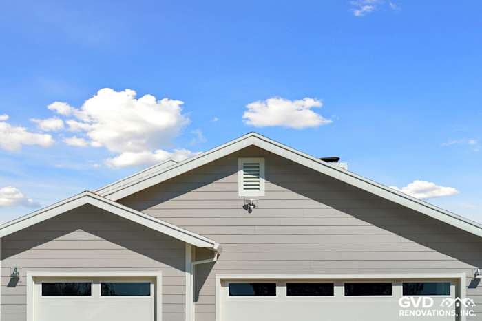 Pearl Gray James Hardie siding with Arctic White trim on a Galt, CA home exterior, under a clear blue sky