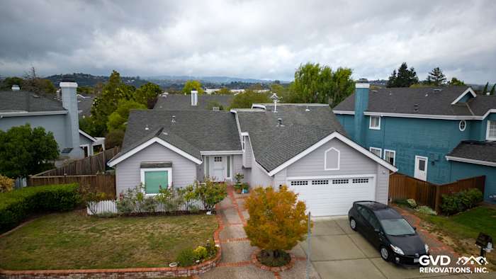 Home exterior featuring new Pearl Gray James Hardie siding and Milgard windows in Foster City, CA