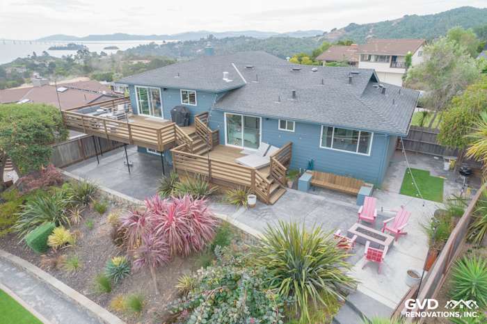 Home exterior featuring Evening Blue James Hardie siding, Anlin Catalina Windows, and an expansive deck in San Rafael, CA