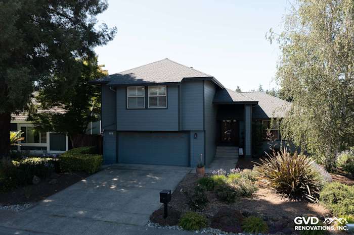 Two-story home exterior featuring Boothbay Blue James Hardie siding and Milgard windows in Rohnert Park, CA