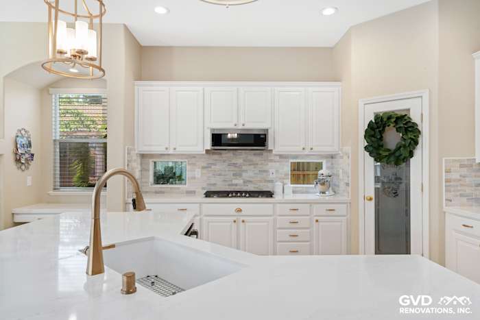 Bright Sacramento kitchen remodel featuring white cabinetry, quartz countertops, and modern fixtures
