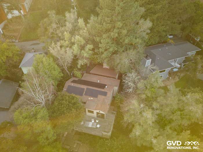 Oakland home featuring Khaki Brown James Hardie siding, Timber Bark HardieTrim, and solar panels, surrounded by trees