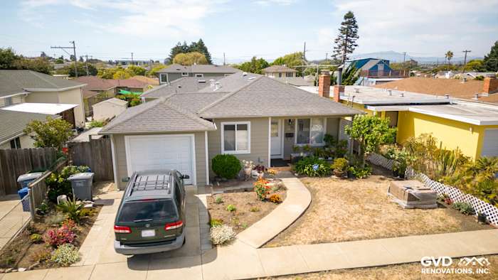 Renovated El Cerrito home with James Hardie siding, Monterey Taupe, and Arctic White trim, front landscaping visible