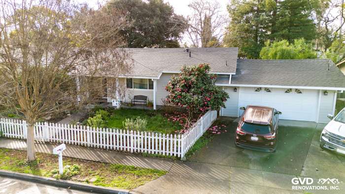 Updated home exterior featuring James Hardie Cobble Stone siding and Anlin Windows with landscaped yard in Napa, CA