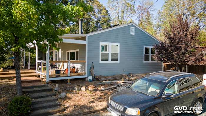 Home exterior featuring James Hardie Gray Slate siding, Arctic White trim, and Milgard windows in Meadow Vista, CA
