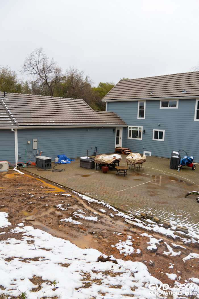 James Hardie Boothbay Blue siding on home exterior with Milgard windows and outdoor furniture in Sutter Creek
