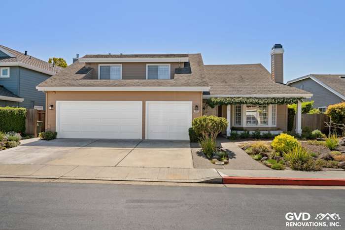 Foster City home exterior with Khaki Brown James Hardie siding and Arctic White trim, landscaped front yard