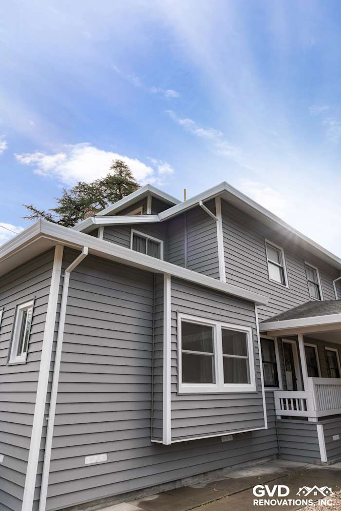 Stylish gray vinyl siding on a home exterior in Dixon, showcasing a modern renovation with clean lines