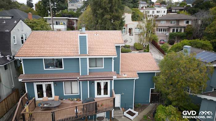 Evening Blue Cedarmill HardiePlank siding with Rustic Grain Arctic White trim on a two-story Oakland home