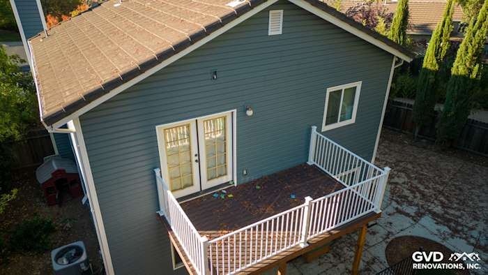 New Alside Prodigy vinyl siding in a muted blue on a Folsom home, featuring a back deck and white railing