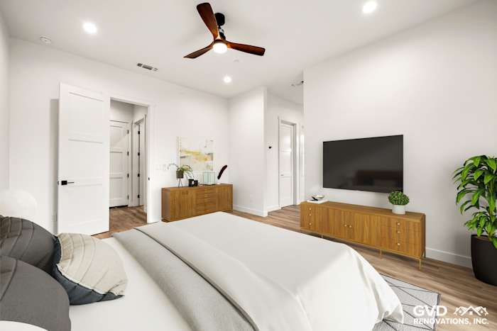 Modern bedroom in new construction home featuring a stylish fan, natural light, and mid-century furniture in Paradise, CA