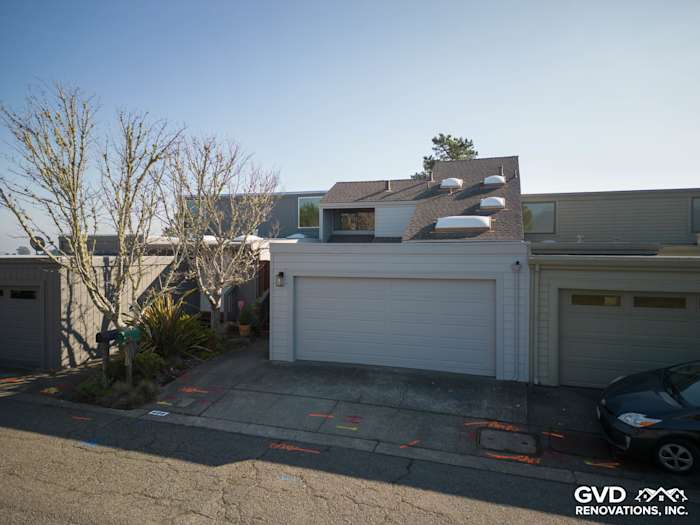 Modern home exterior featuring Pearl Gray James Hardie Lap Siding in Mill Valley, CA, with updated garage and landscaping
