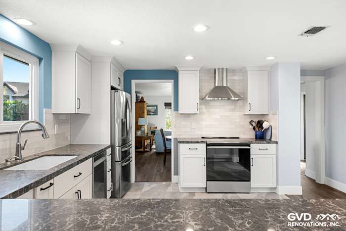 Modern Fair Oaks kitchen remodel featuring quartz countertops, stainless steel appliances, and blue accent wall