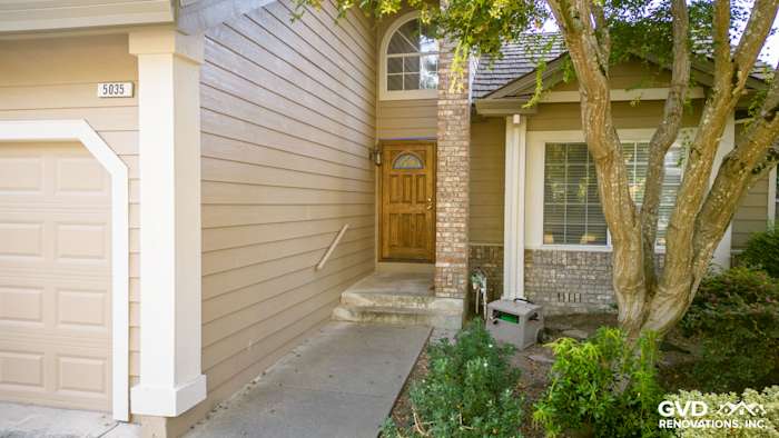 Updated home exterior featuring James Hardie Khaki Brown siding, Alside Vinyl windows, and brick accents in Santa Rosa