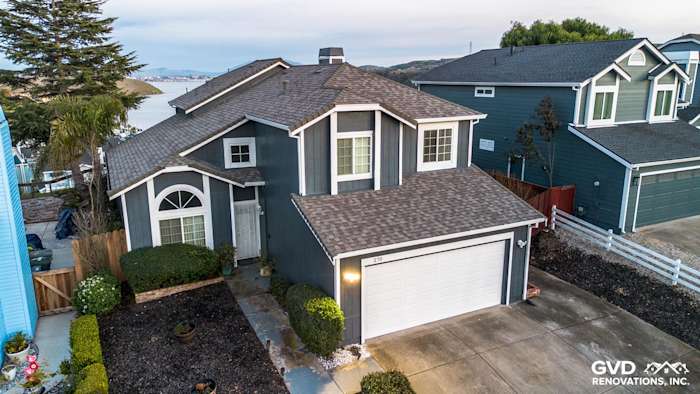 Two-story home in Vallejo with James Hardie Evening Blue siding, Arctic White trim, and fresh landscaping