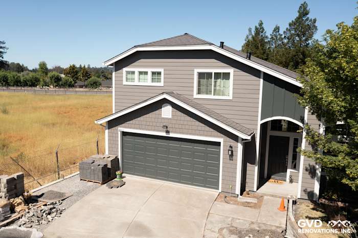 Rohnert Park home with James Hardie Aged Pewter siding, Arctic White trim, and modern garage door