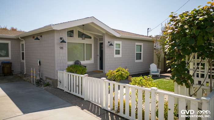 Mill Valley home with new Pearl Gray James Hardie shingle siding and Arctic White trim. White picket fence and front yard