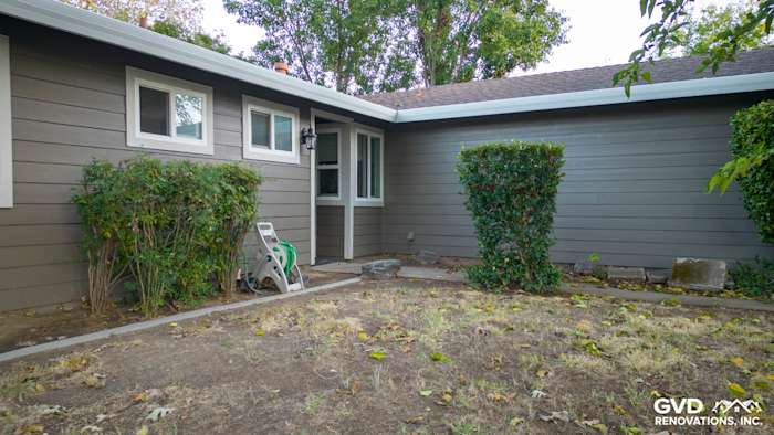 Cobble Stone James Hardie siding on a home exterior in Orangevale, featuring new windows and landscaping