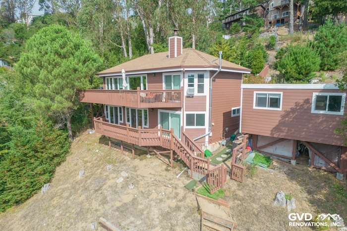 Home exterior in Mill Valley featuring James Hardie Lap Siding and Anlin Catalina Windows, surrounded by greenery