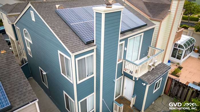 Evening Blue HardiePlank siding installed on a two-story home in Daly City, showcasing modern architecture and solar panels