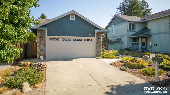 Evening Blue James Hardie Lap Siding with Cobble Stone Trim on Petaluma home's garage and landscaping