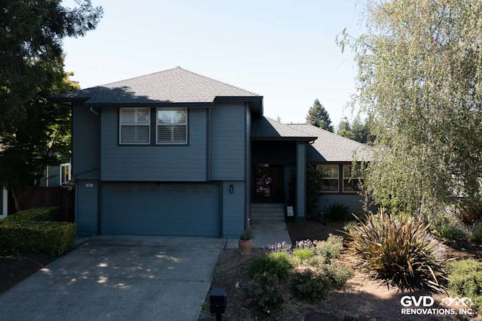 Home exterior featuring new Cedarmill 8.25 lap siding in Boothbay Blue and Milgard windows in Rohnert Park
