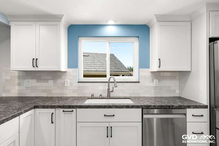Modern kitchen remodel featuring white cabinets, gray quartz countertop, and blue accent wall in Fair Oaks, CA