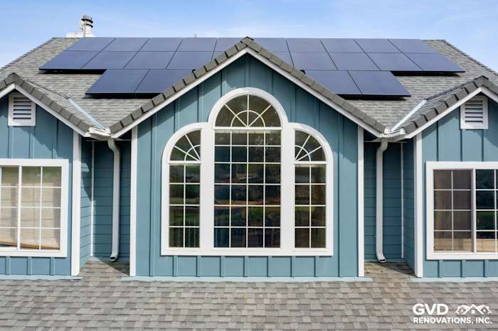 New James Hardie siding in blue with stylized windows and solar panels on a Shingle Springs home